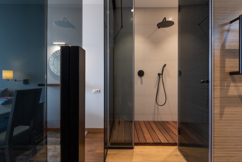 Interior of modern apartment with shower cabin
